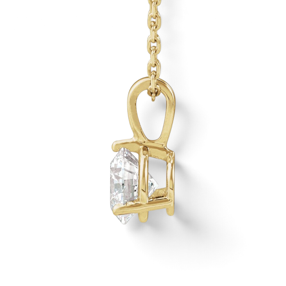 Stórica Studio Vesper necklace featuring a round lab-grown diamond in a 14k yellow gold three-prong solitaire setting.