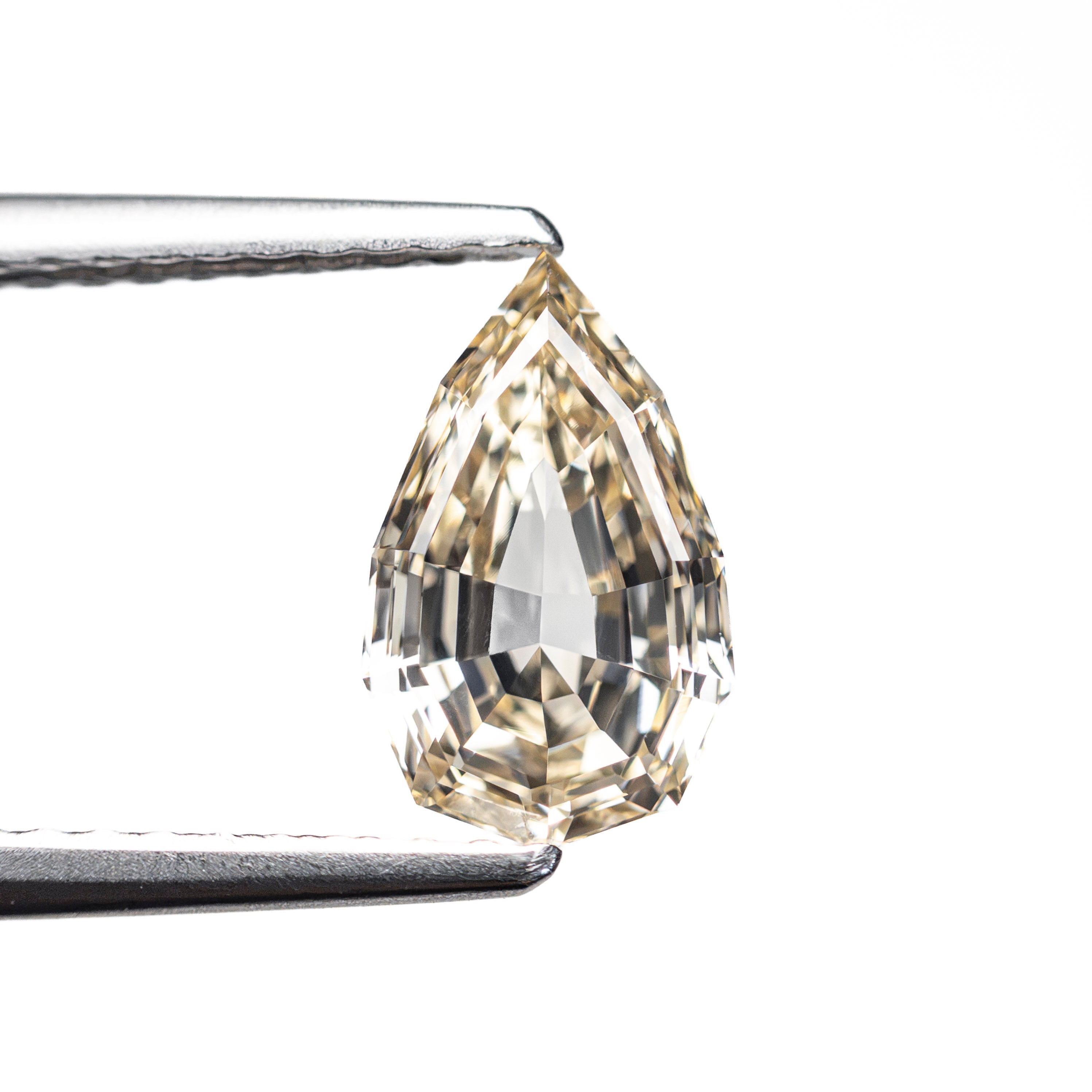1.21ct 9.11x5.57x3.36mm VVS2 Fancy Light Yellowish Brown Geo Pear Step Cut 28047-01