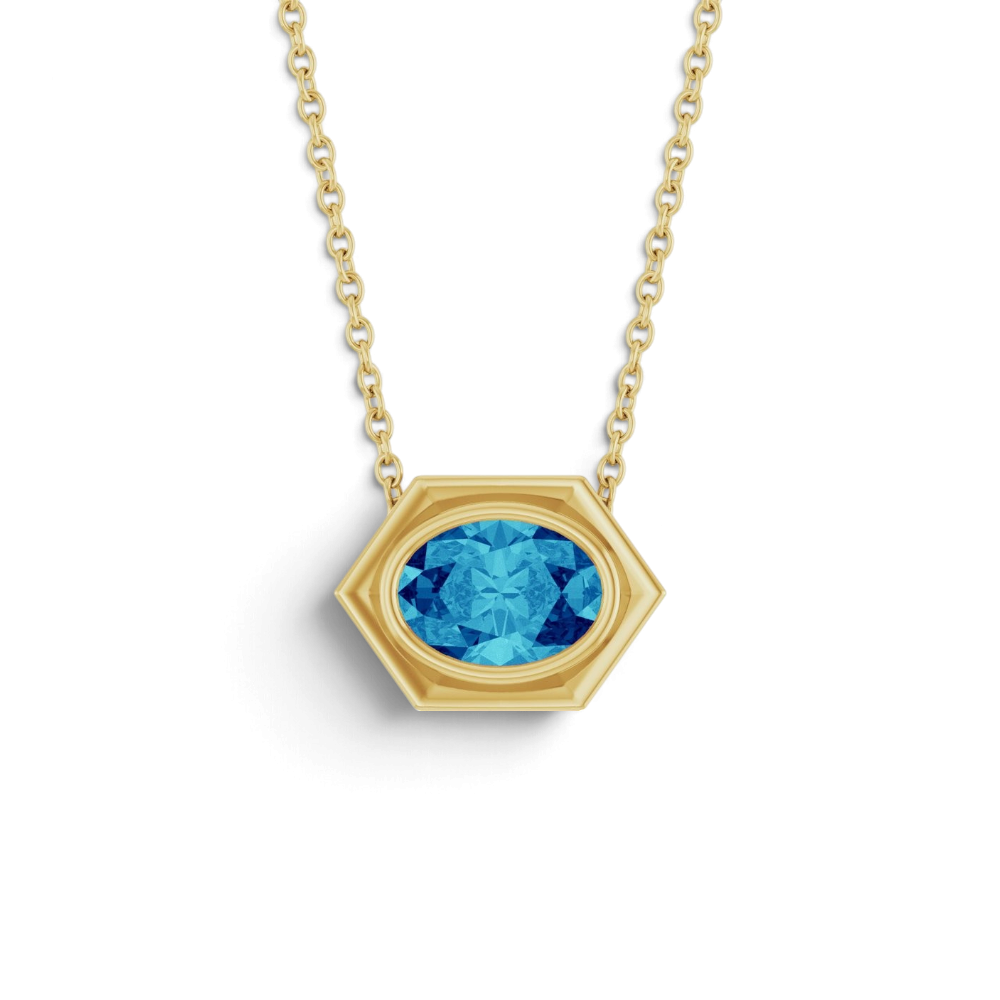 Stórica Studio Tidepool necklace featuring an oval blue zircon gemstone in a 14k yellow gold bezel slide setting.