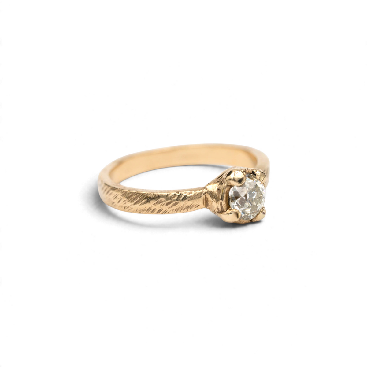 Stórica Studio Bramble textured 14k yellow gold solitaire with an antique Old European cut diamond, side view
