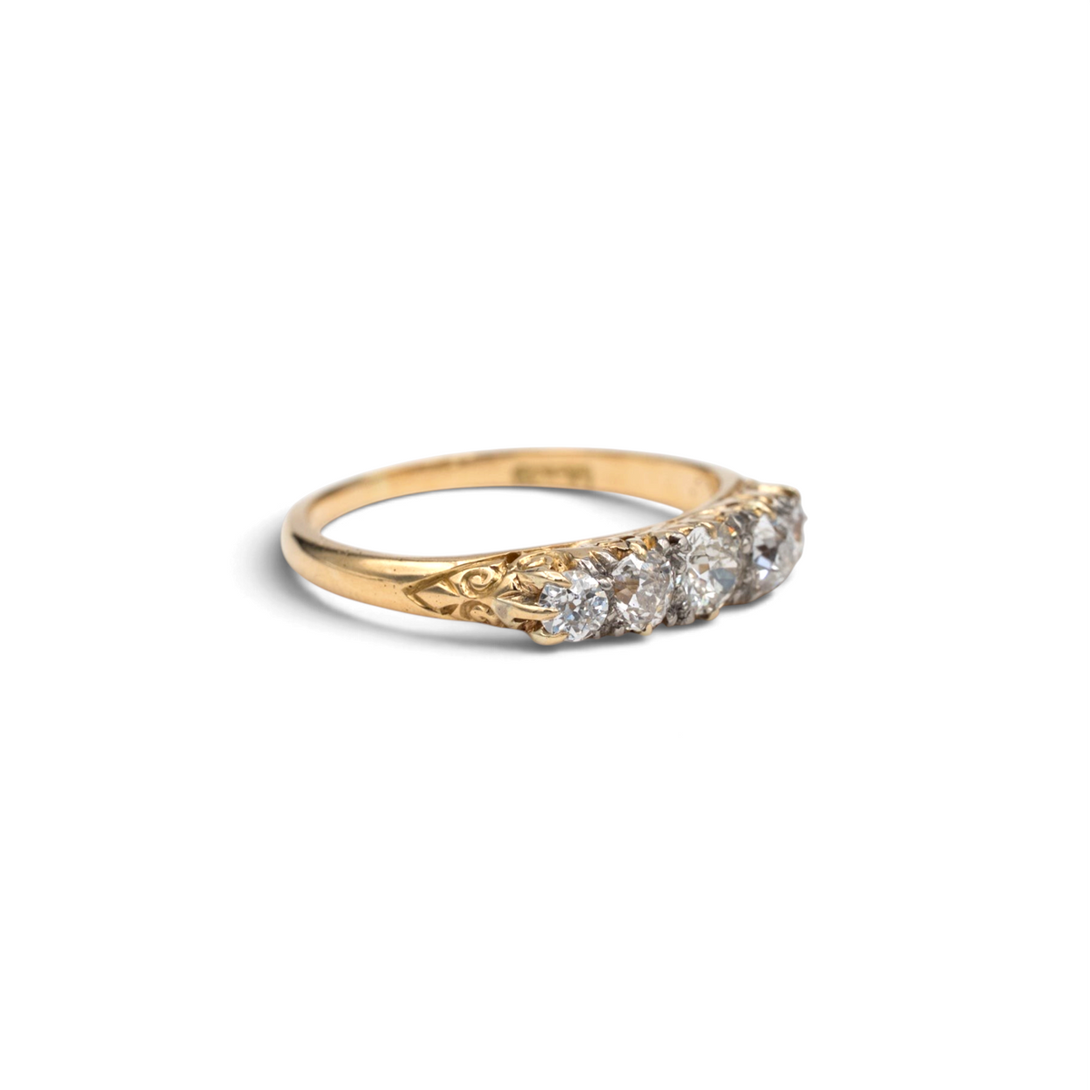 Stórica Studio Yarrow antique five stone diamond ring in 18k yellow gold with carved scroll shoulders