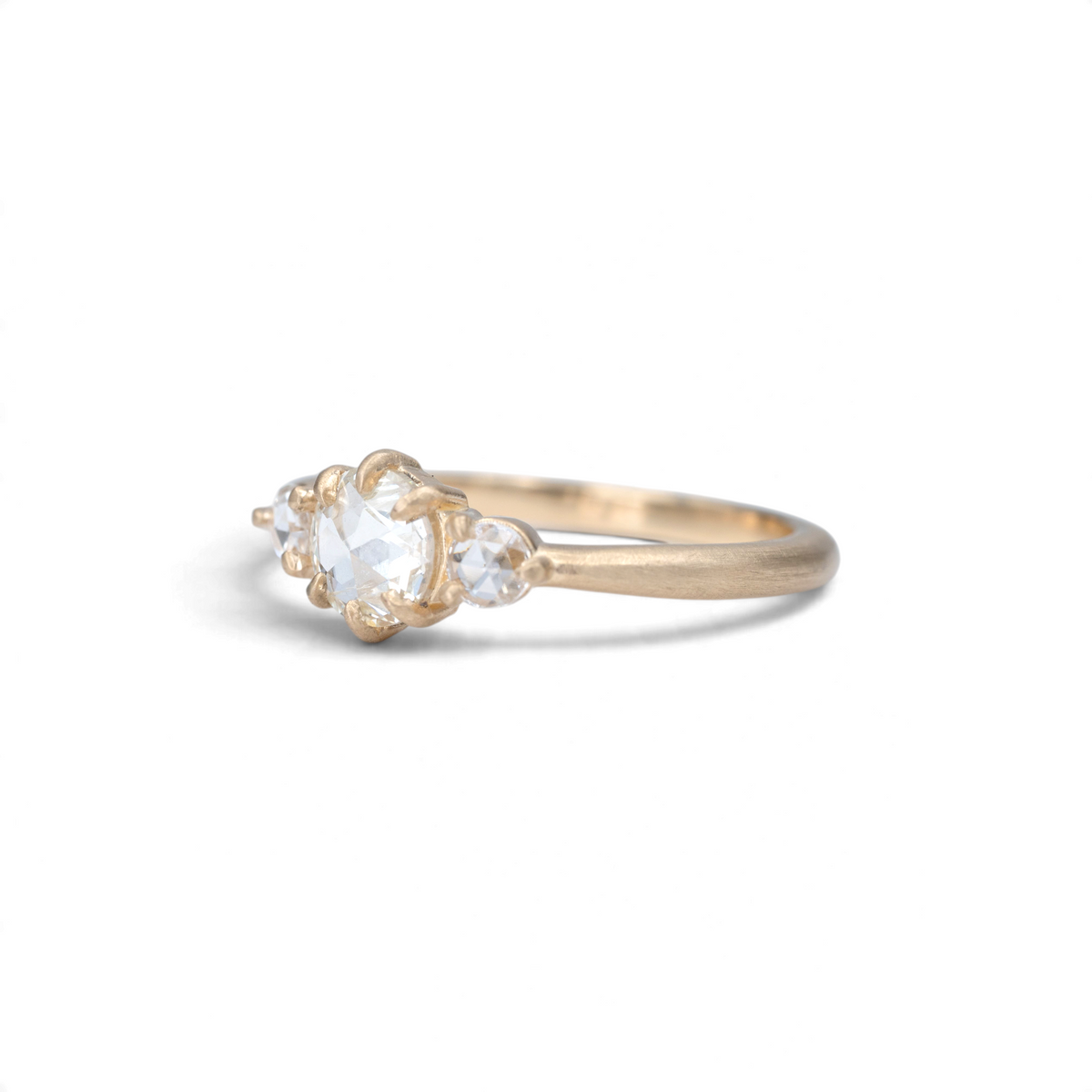 Stórica Studio The Alder three stone ring with rose cut diamonds in matte 14k yellow gold with claw prongs