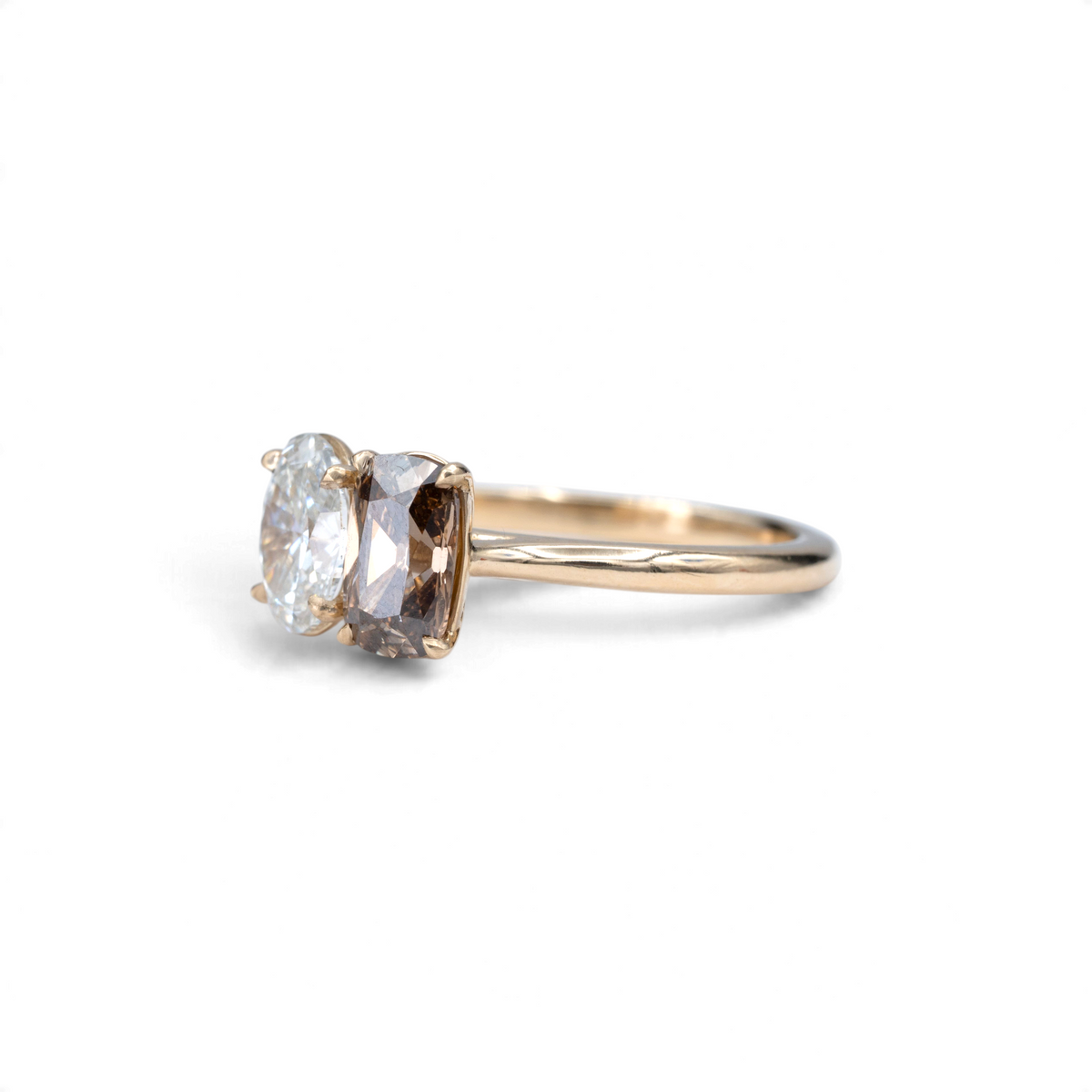 Stórica Studio toi et moi ring featuring a champagne cushion and oval lab-grown diamond in 14k yellow gold