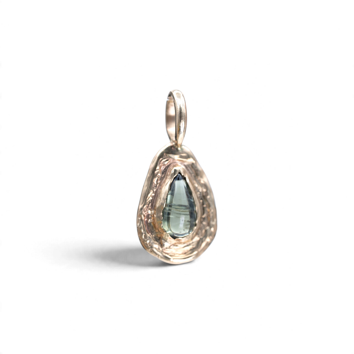 Stórica Studio Moonpool pendant featuring a 2.60ct pear sapphire cabochon set in hand-carved 14k yellow gold.