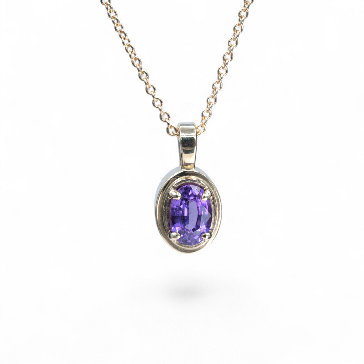 Aster oval purple sapphire charm in 14k yellow gold on an 18 inch cable chain