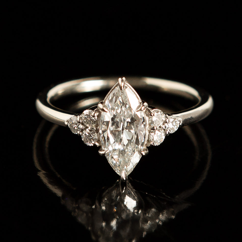 Holly Ring featuring an antique marquise diamond.