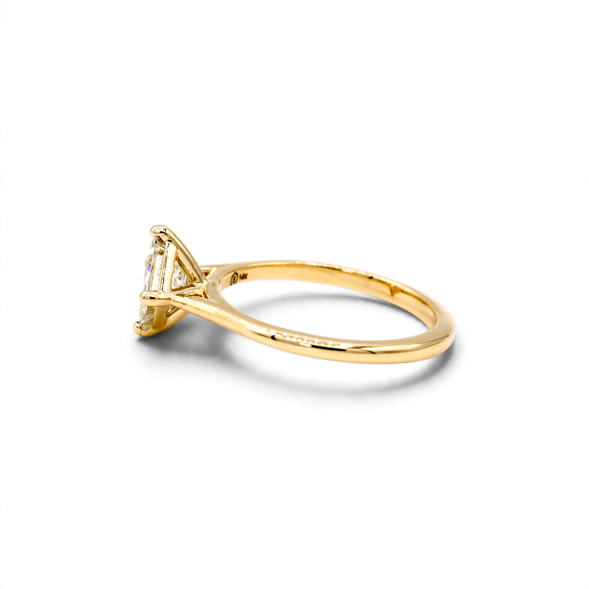 Stórica Studio Sequoia engagement ring with a 1.22ct antique carré cut diamond in a 14k yellow gold cathedral setting