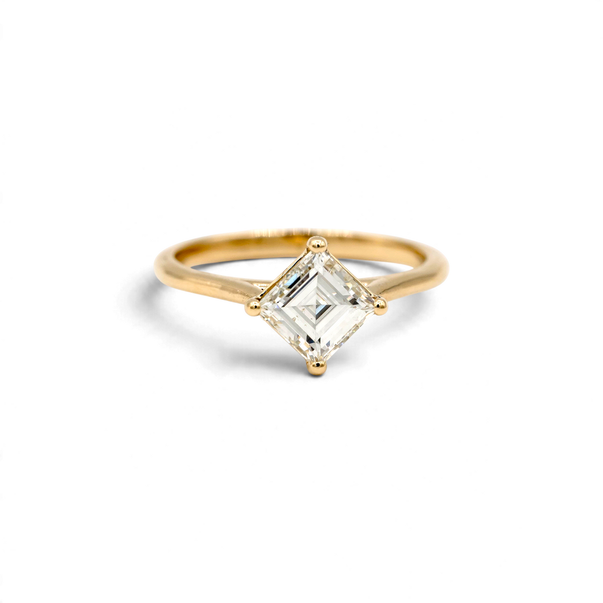 Stórica Studio Sequoia engagement ring featuring a 1.22ct antique carré cut diamond in 14k yellow gold kite setting.