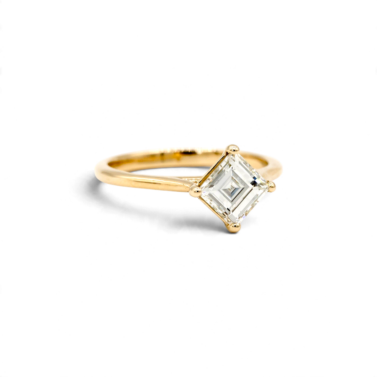 Stórica Studio Sequoia engagement ring featuring a 1.22ct antique carré cut diamond in 14k yellow gold kite setting.
