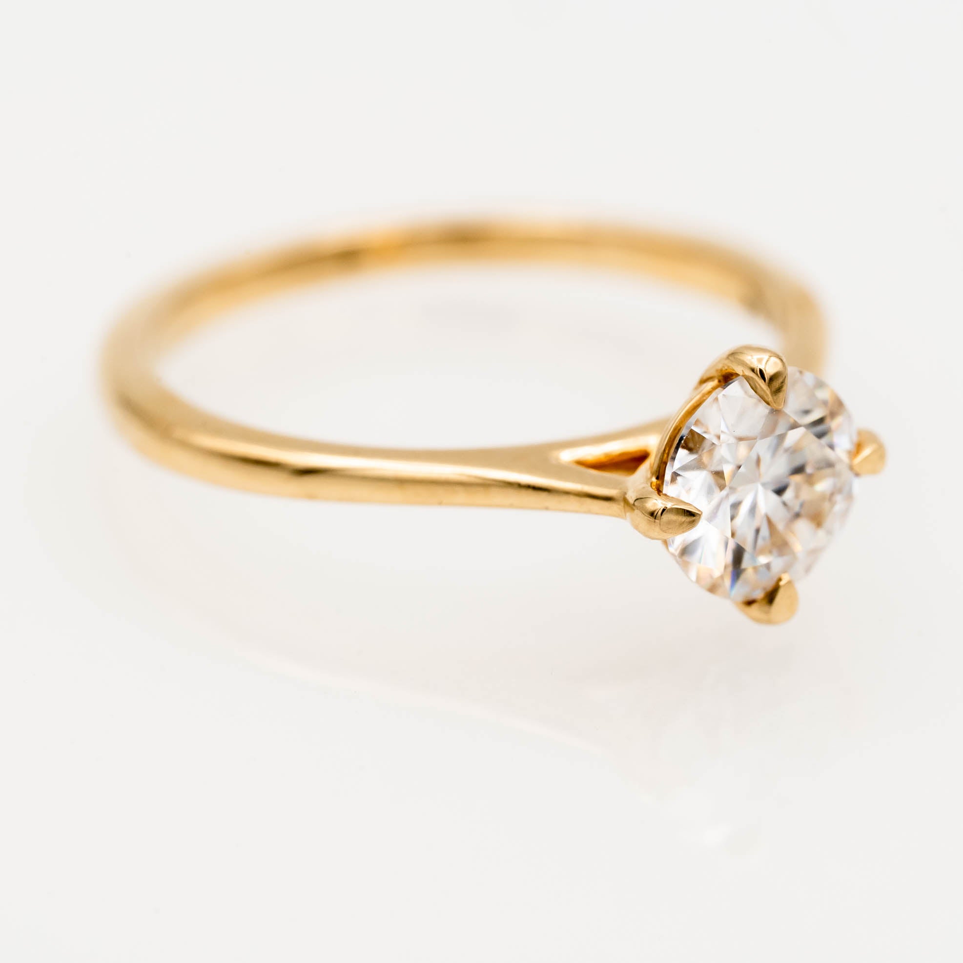 solitaire engagement ring, round-cut diamond ring, 14K yellow gold ring, classic diamond ring, minimalist engagement ring, prong setting ring, timeless jewelry, elegant proposal ring.
