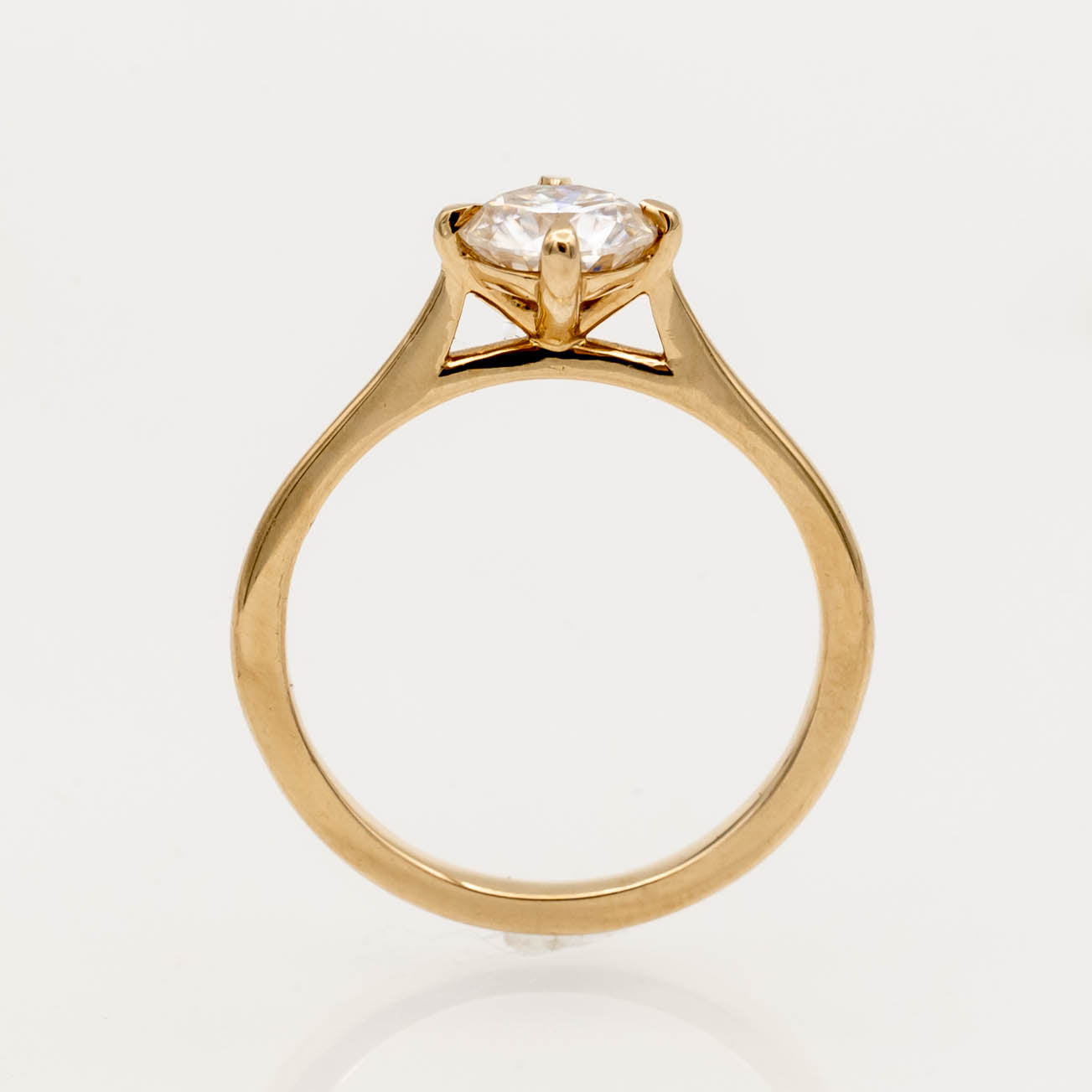 solitaire engagement ring, round-cut diamond ring, 14K yellow gold ring, classic diamond ring, minimalist engagement ring, prong setting ring, timeless jewelry, elegant proposal ring.