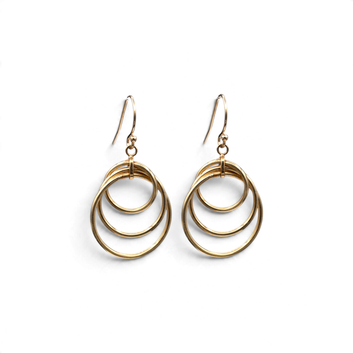 Ripple vintage 14k yellow gold drop earrings with three graduated circles on French wire ear hooks, by Stórica Studio