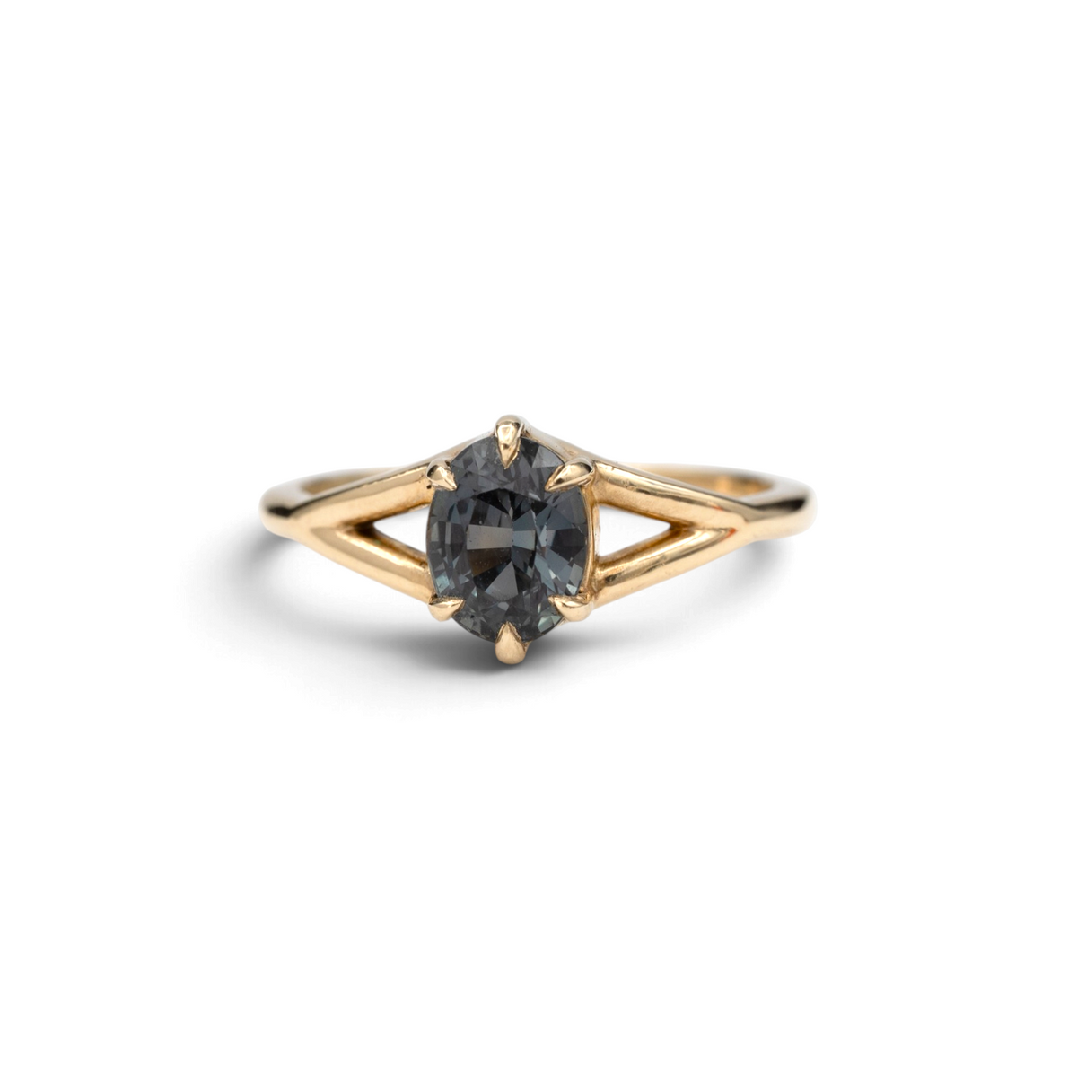 Stórica Studio Juniper engagement ring with a 1.53 ct oval color-change sapphire set in 14k yellow gold split-shank