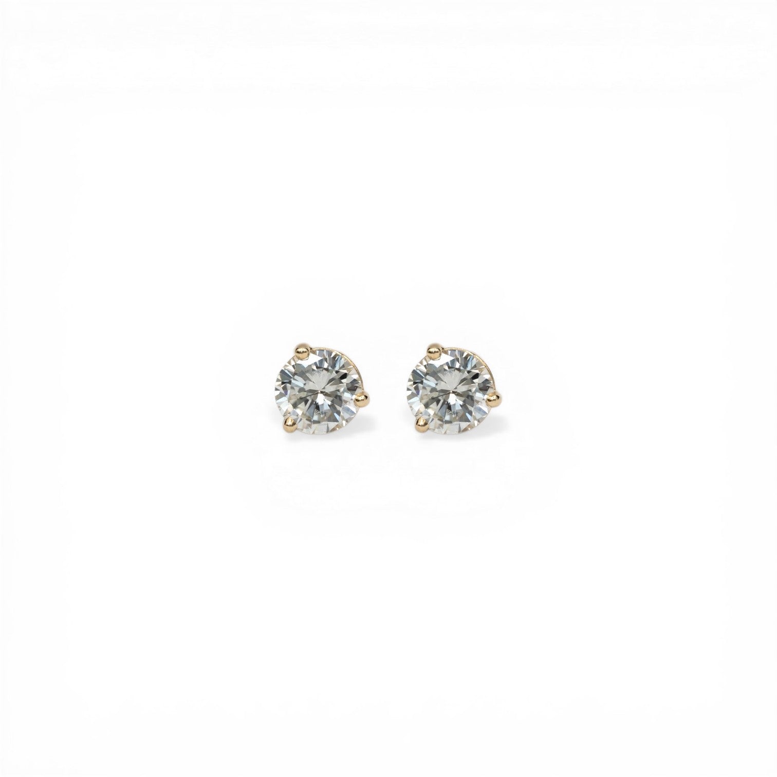Stórica Studio 14k yellow gold stud earrings with 1ct bezel-set recycled diamonds in martini mounting.
