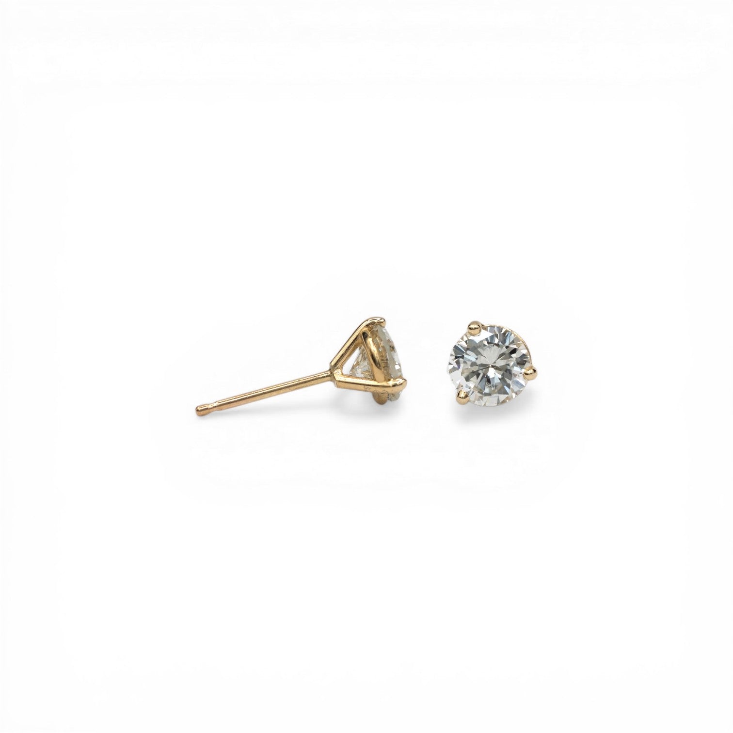 Stórica Studio 14k yellow gold stud earrings with 1ct total weight bezel-set diamonds in martini mountings.