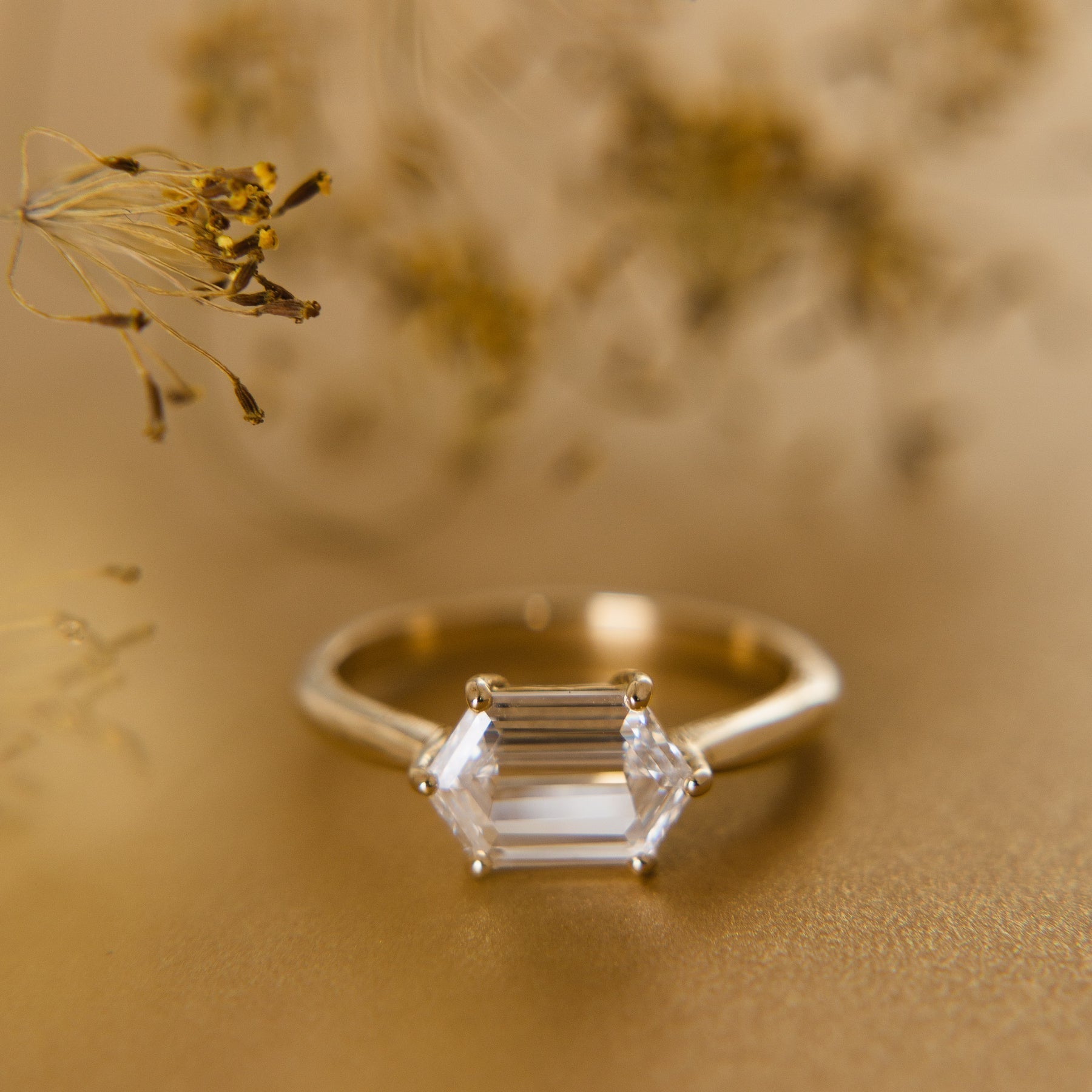 A hexagon diamond solitaire engagement ring