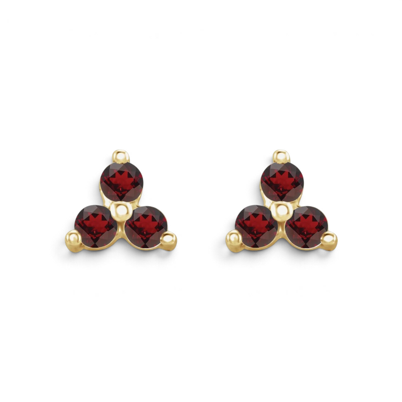 Stórica Studio Anemone stud earrings featuring a three-stone garnet cluster set in polished 14k yellow gold