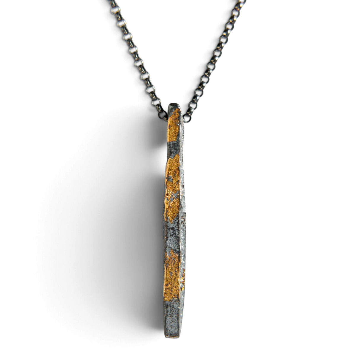 Stórica Studio Gilded Relic bar necklace featuring oxidized sterling silver with 24k gold keum-boo foil accents.