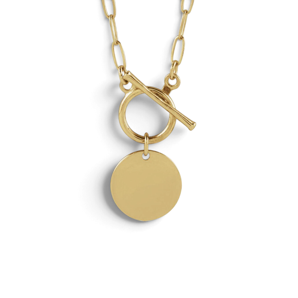Stórica Studio gold paperclip chain necklace with a toggle clasp and a round engravable pendant charm.