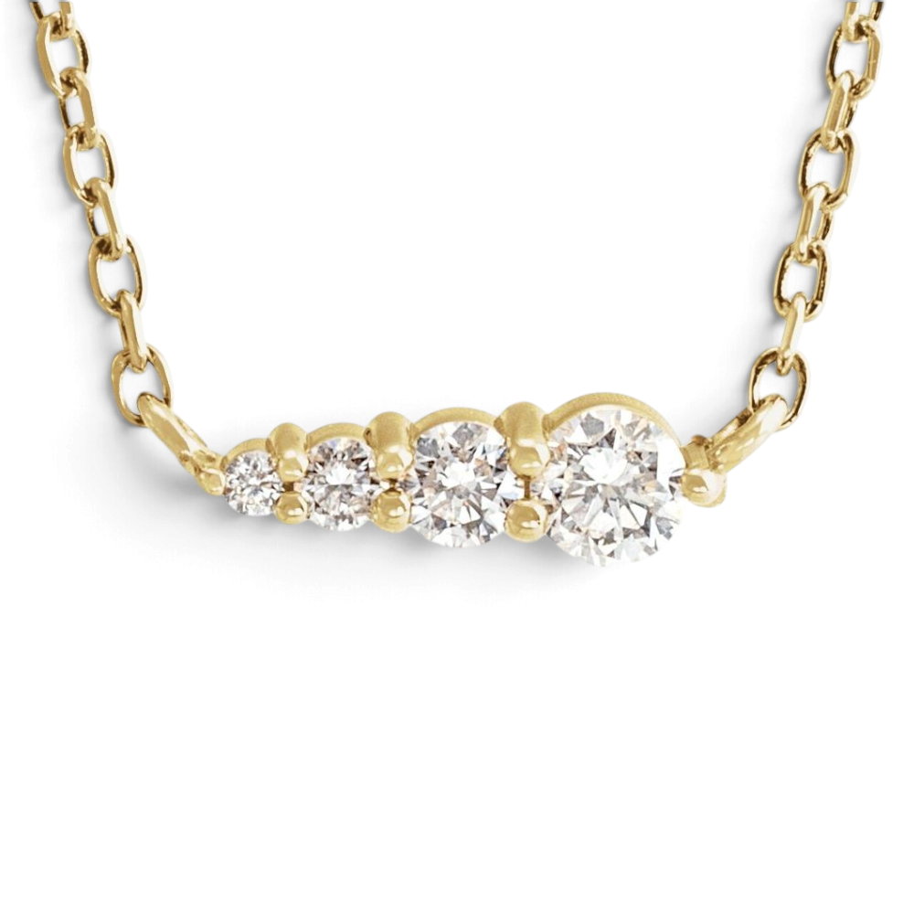 Stórica Studio Sandbar necklace featuring four graduated lab-grown diamonds on a delicate 14k yellow gold cable chain.