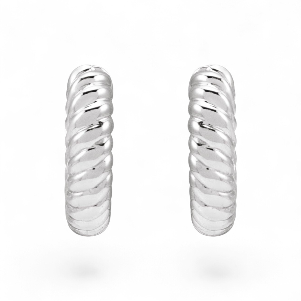 Stórica Studio Mooring huggie hoop earrings in polished sterling silver with a twisted rope texture.