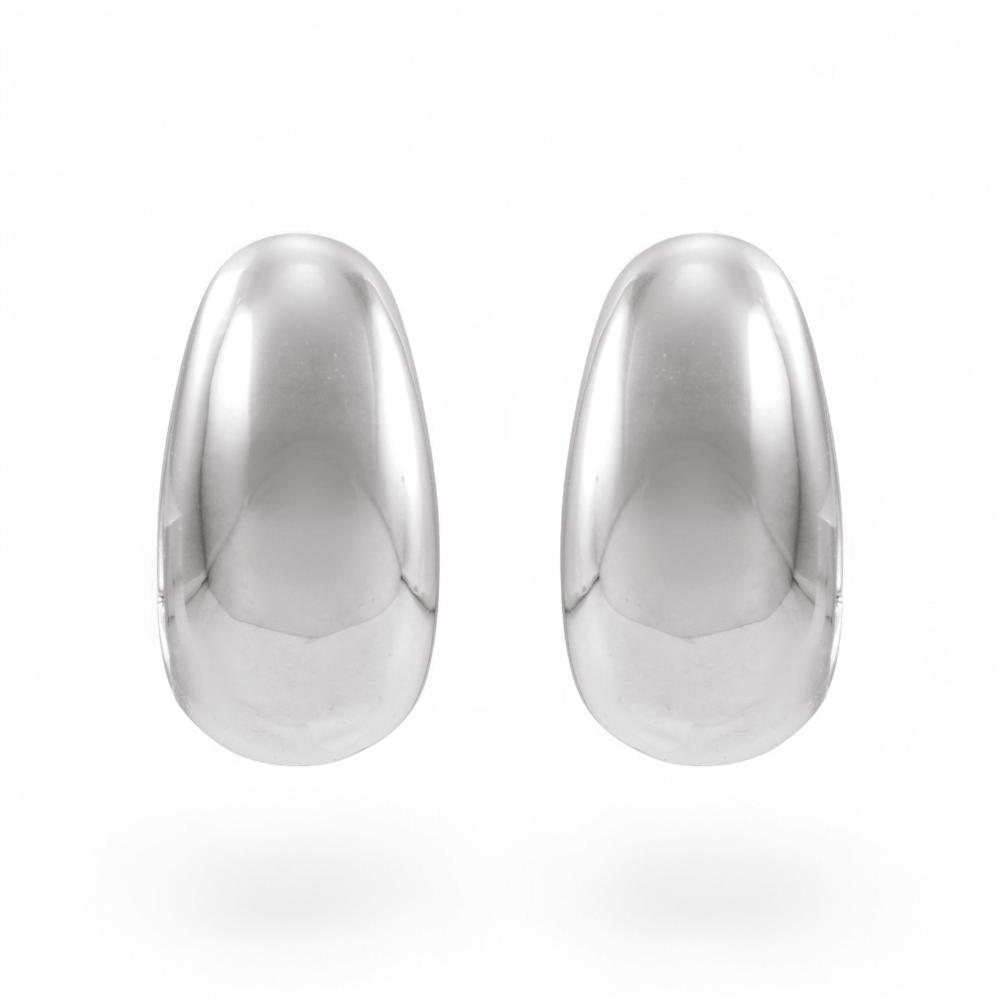 Stórica Studio Buoy puffed huggie hoop earrings in polished solid sterling silver with a rounded, bold profile.