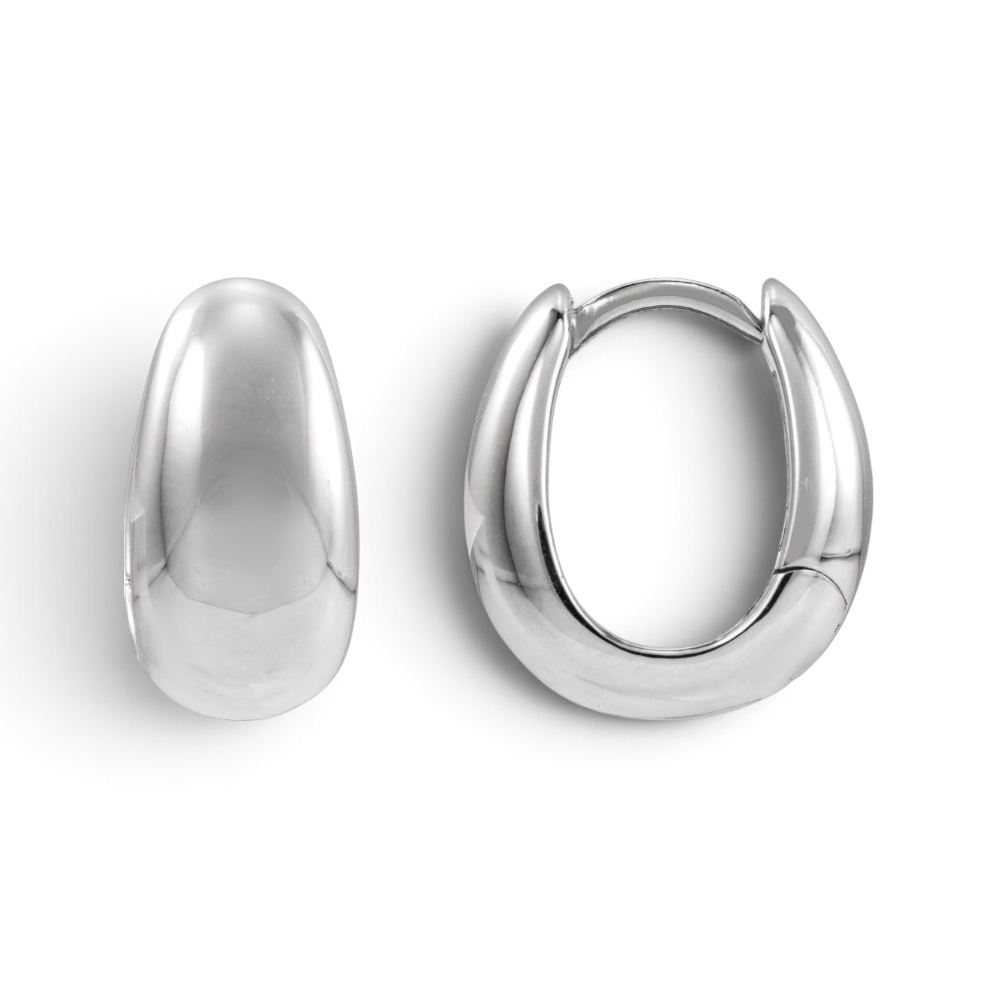 Stórica Studio Buoy sterling silver puffed huggie hoop earrings with a smooth rounded profile and hinged closure.