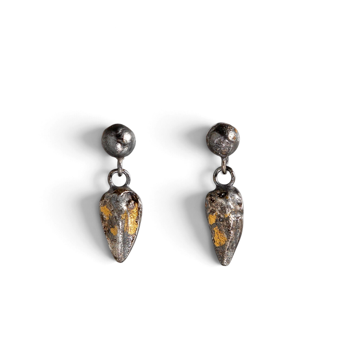 Stórica Studio Gilded Relic drop earrings featuring oxidized sterling silver droplets with 24k gold foil accents.