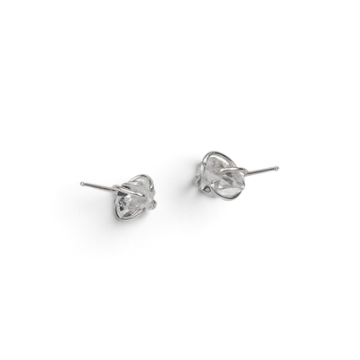 Stórica Studio Herkimer diamond stud earrings featuring raw quartz crystals in 4-prong sterling silver settings.