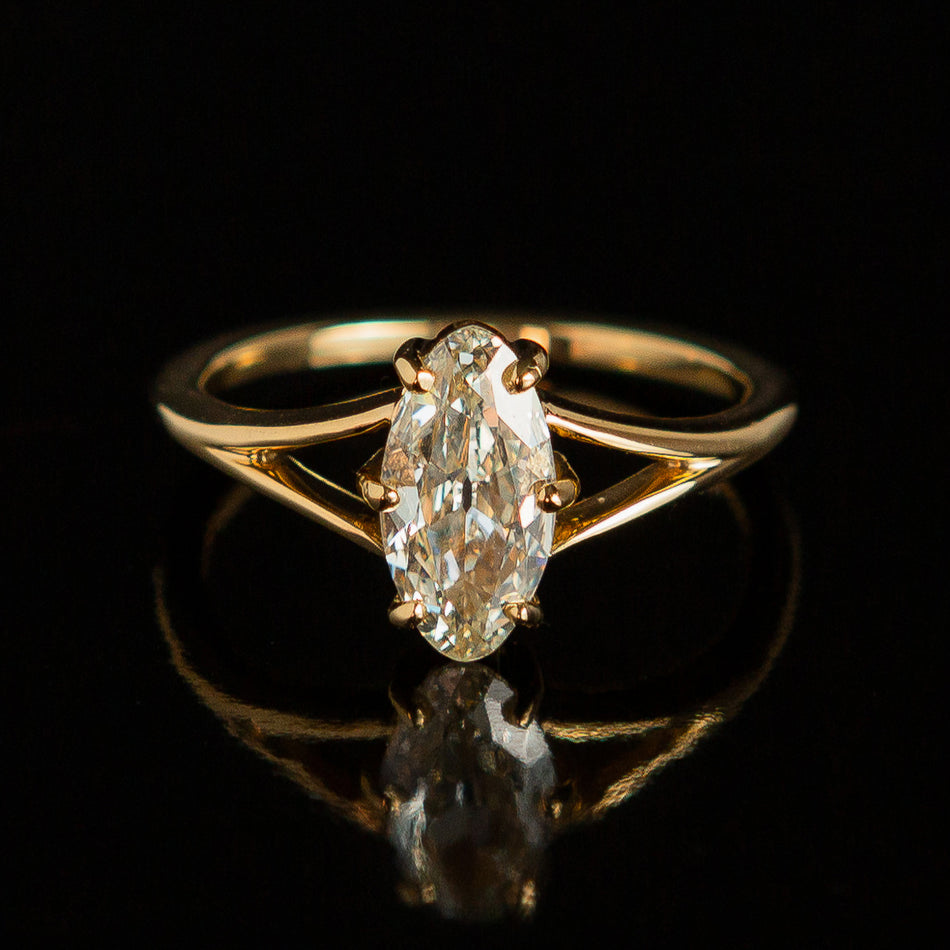Juniper Ring featuring an antique moval diamond.