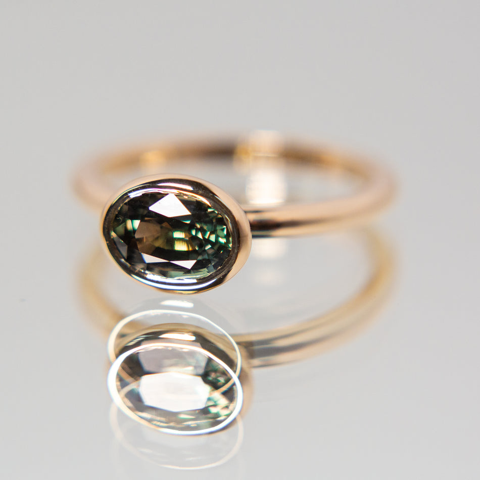 Elm Ring featuring a color change sapphire.