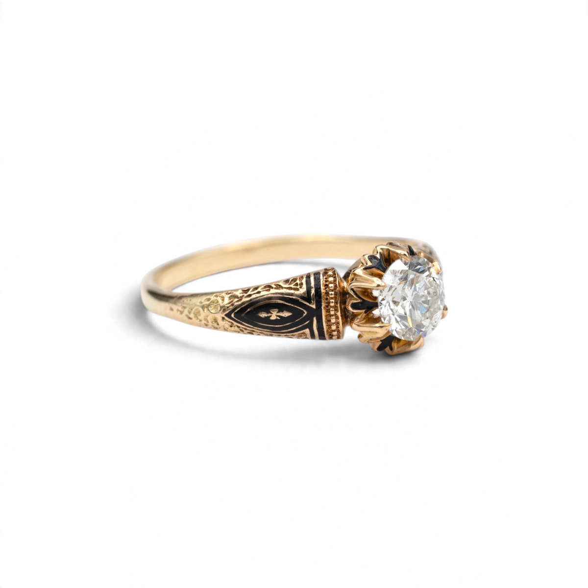 Stórica Studio Hellebore antique diamond ring with black enamel navette shoulders and chased floral detail in 14k yellow gold