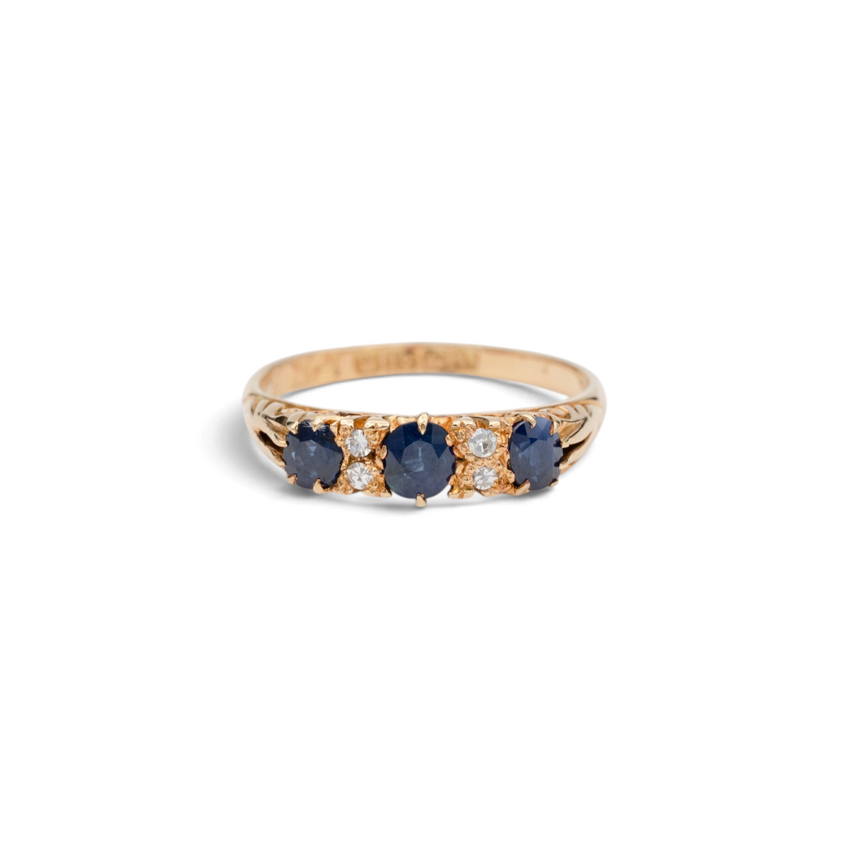 Stórica Studio Victorian 18k yellow gold half-hoop ring featuring oval blue sapphires and small accent diamonds.