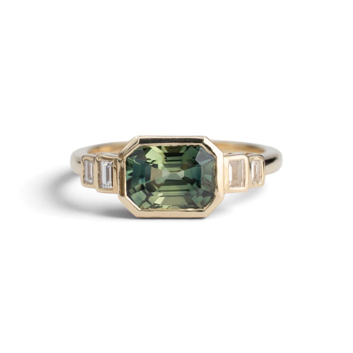 Stórica Studio 2.25ct emerald cut Australian sapphire ring in 14k yellow gold with baguette diamond side stones