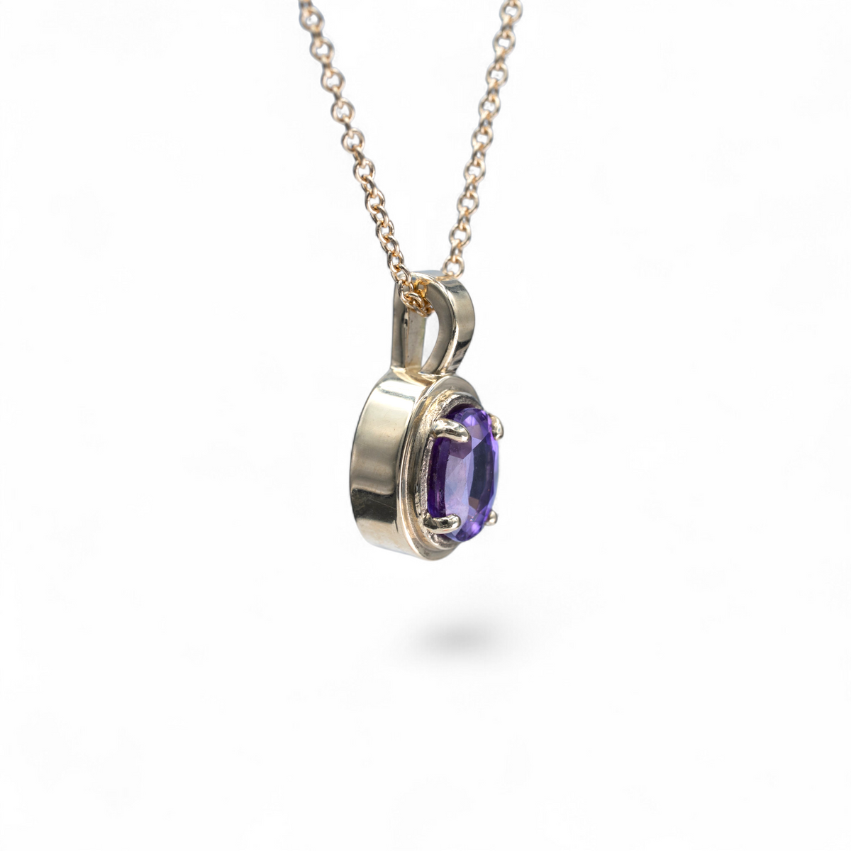 Aster purple sapphire charm in 14k yellow gold, alternate view on a fine cable chain