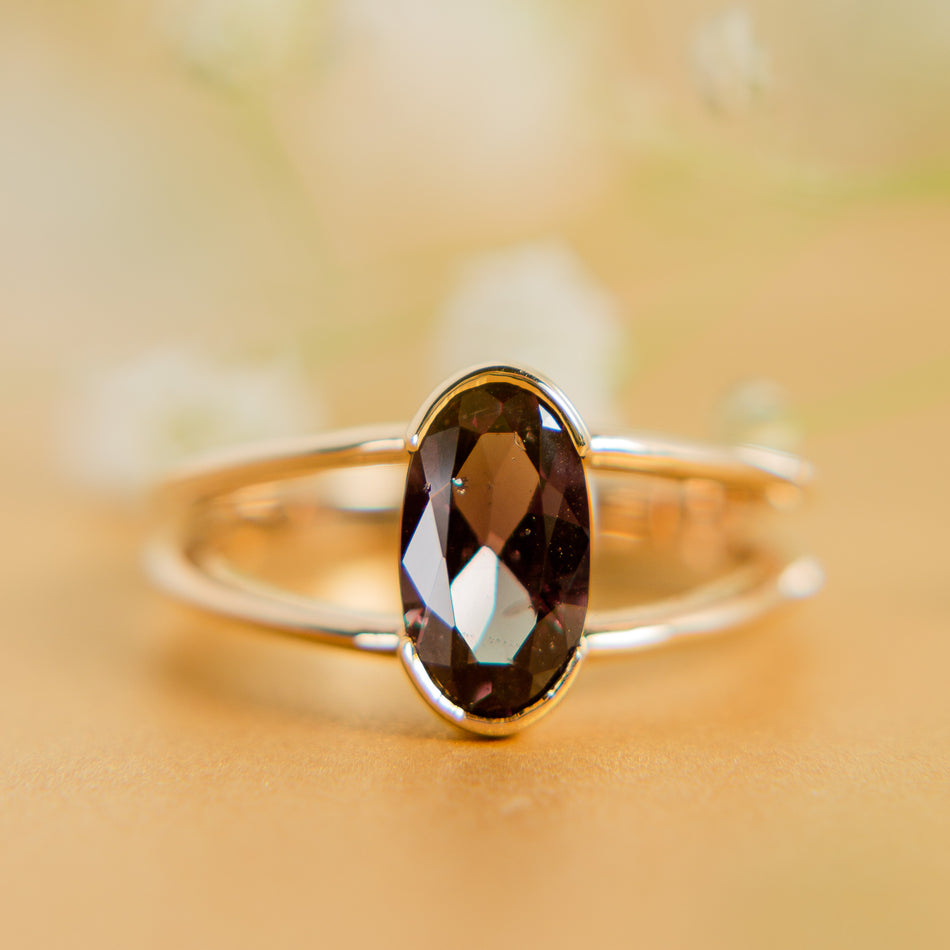 Willow Ring featuring a color change garnet.