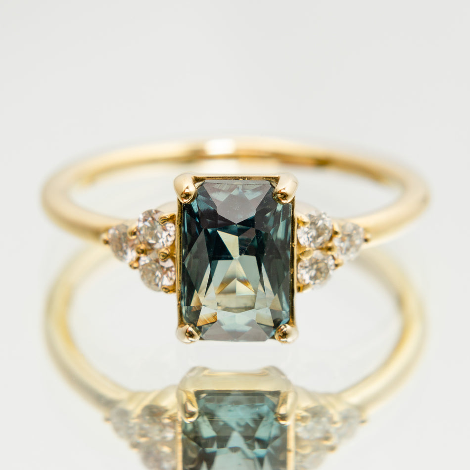 Holly Ring featuring a radiant cut sapphire.