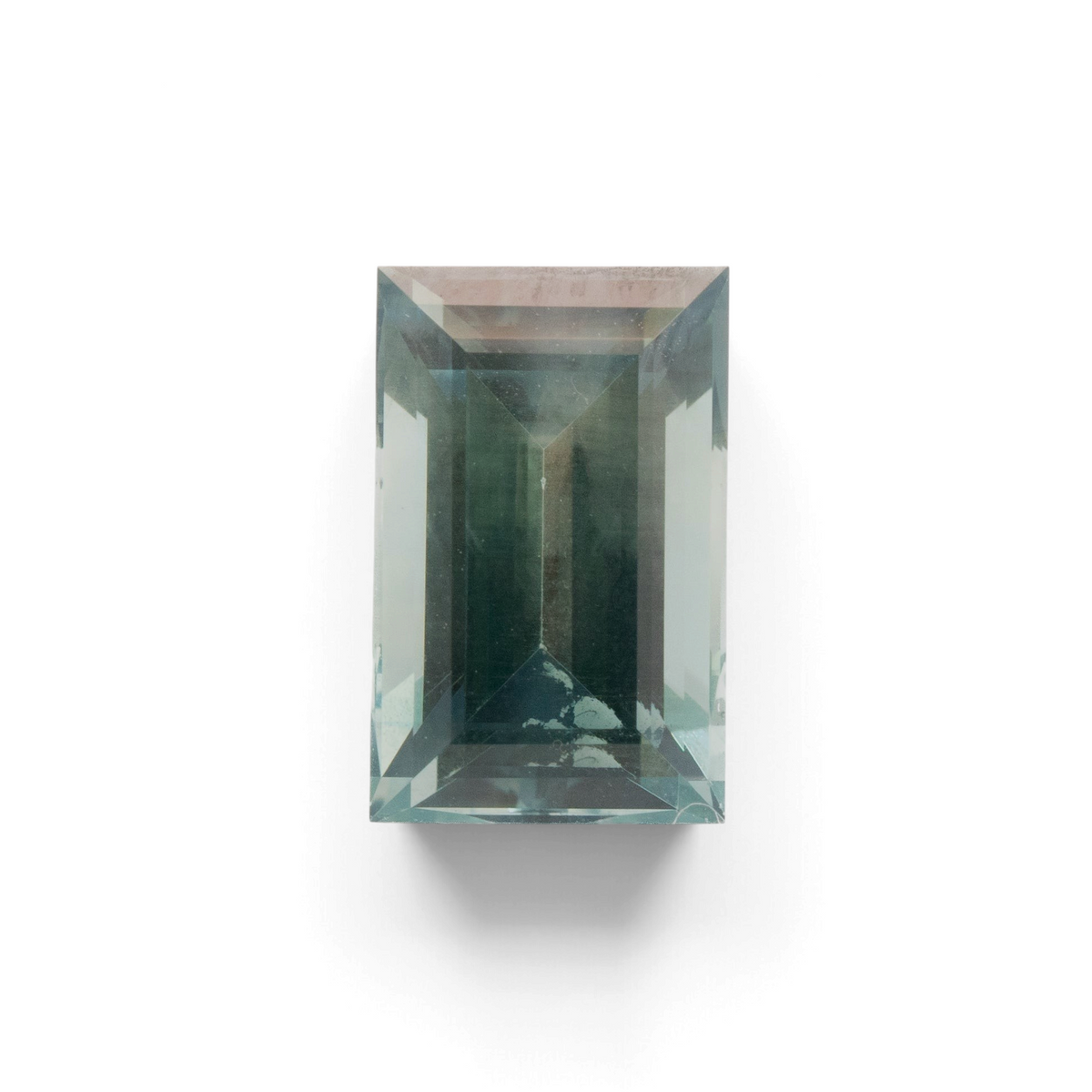 Stórica Studio 3.18ct unheated Montana sapphire with a teal green-blue hue and a geometric baguette step-cut.