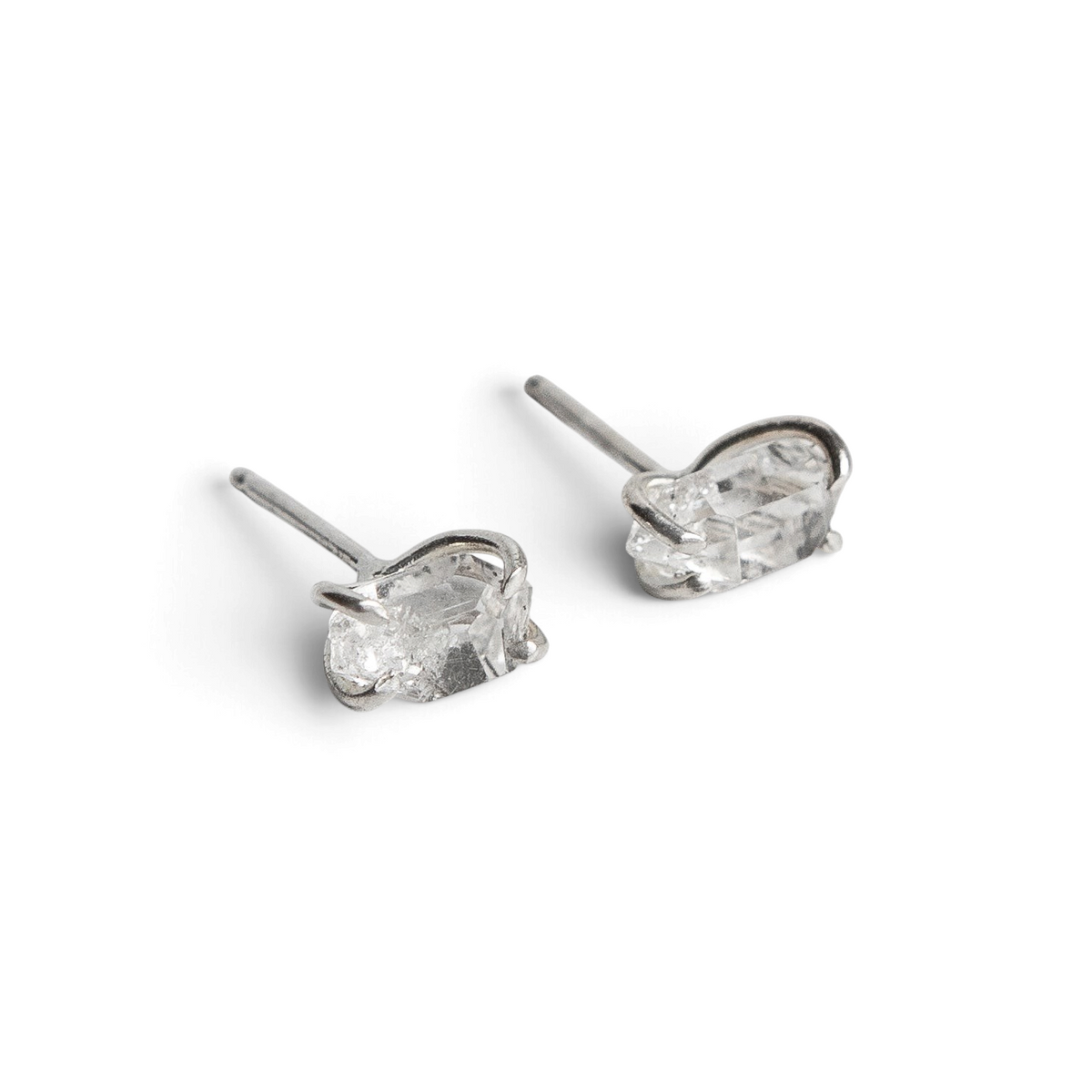 Stórica Studio raw Herkimer diamond stud earrings in high shine sterling silver with a 4-prong setting.