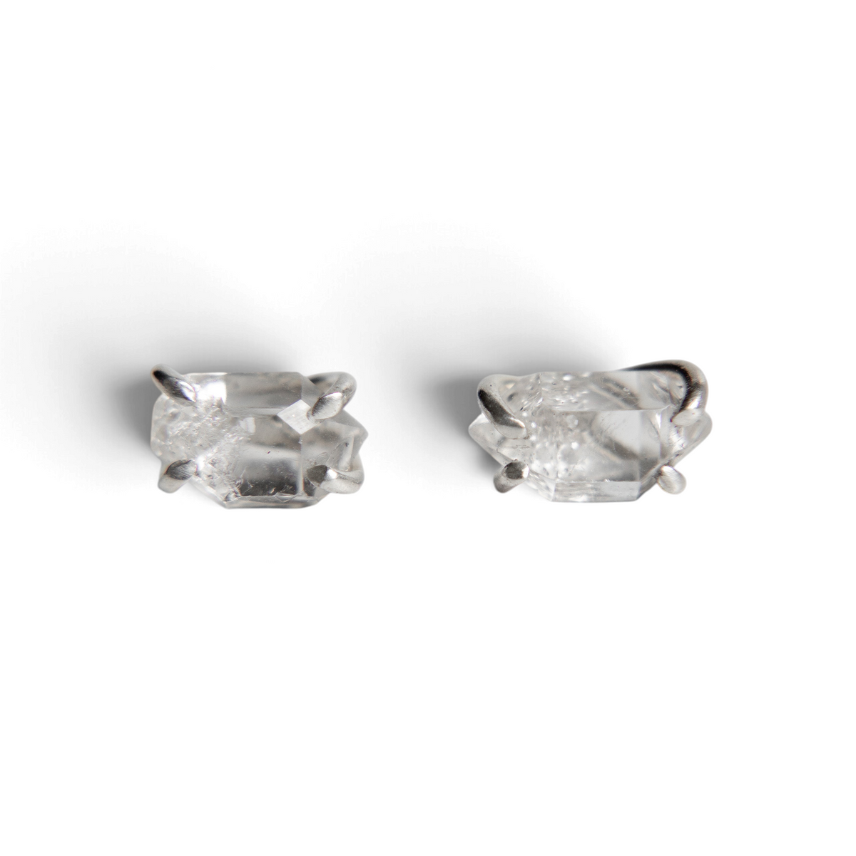 Stórica Studio raw Herkimer diamond stud earrings in 4-prong sterling silver settings on a white background