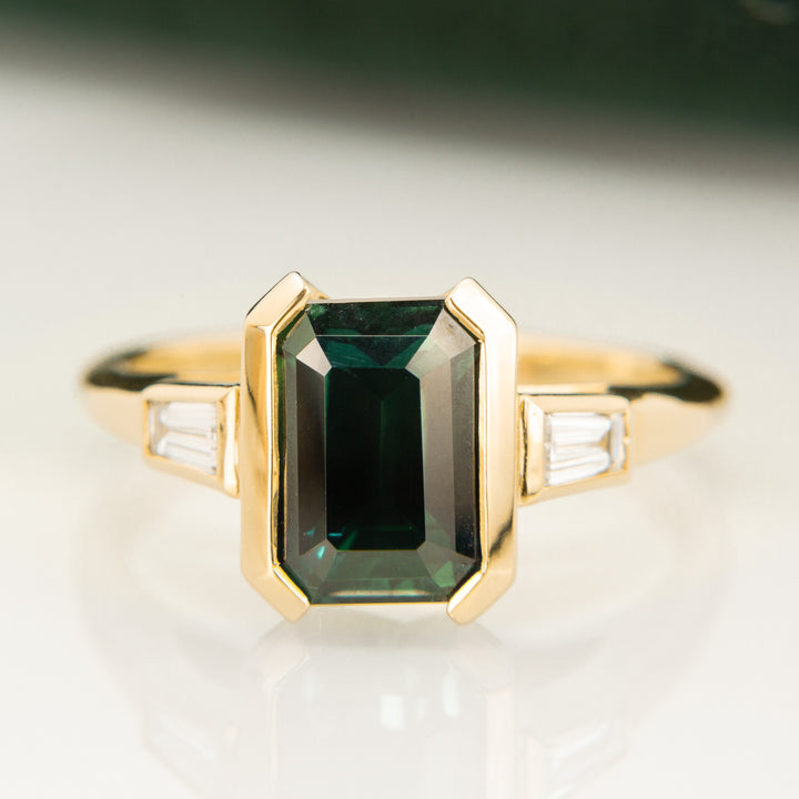 Emerald Cut Teal Sapphire Trilogy Ring in 18k Yellow Gold