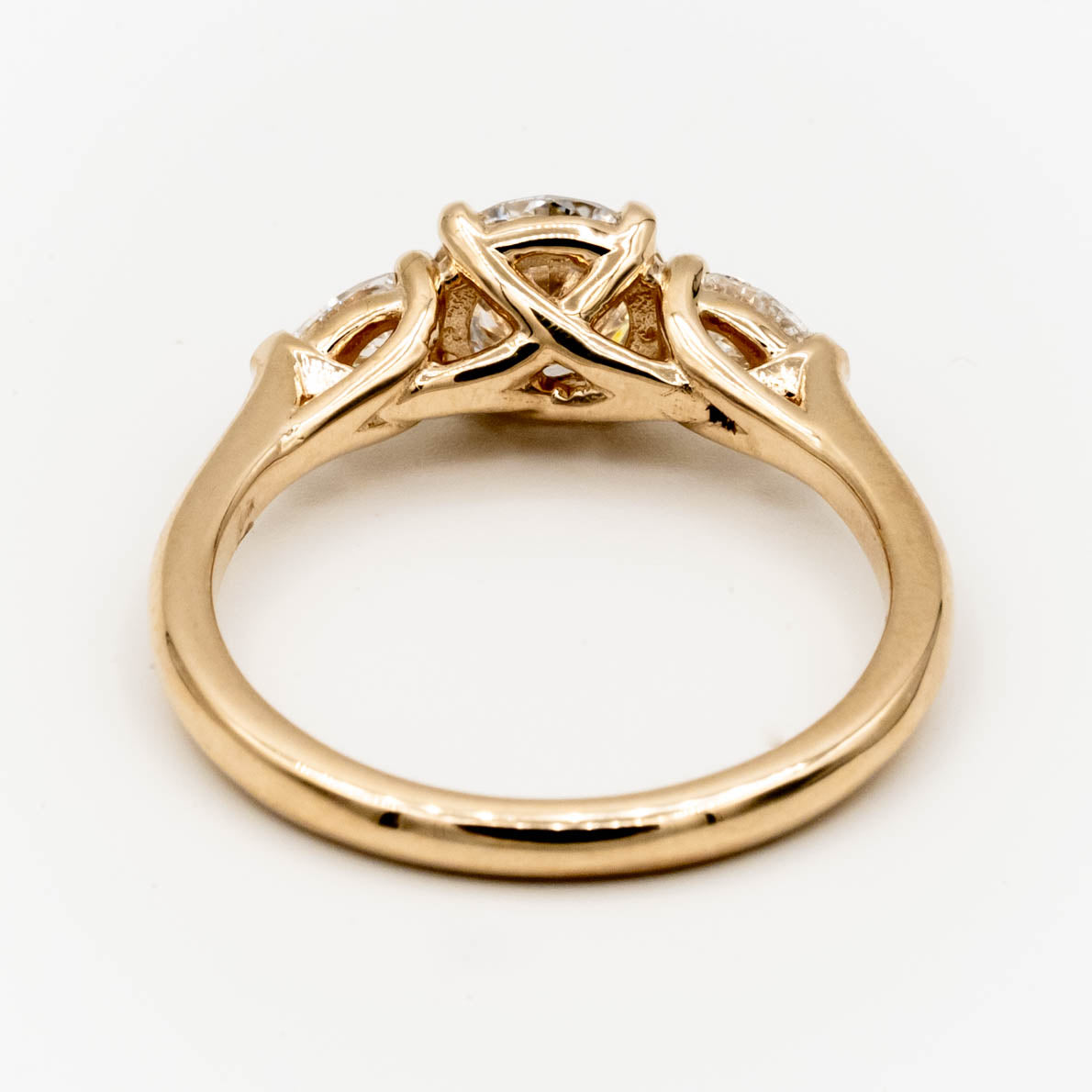 Storica’s classic 3-stone engagement ring featuring a 1 carat D color, VVS2 clarity lab-grown diamond center and pear-shaped lab-grown diamonds in a trellis setting, crafted in 14k yellow gold.