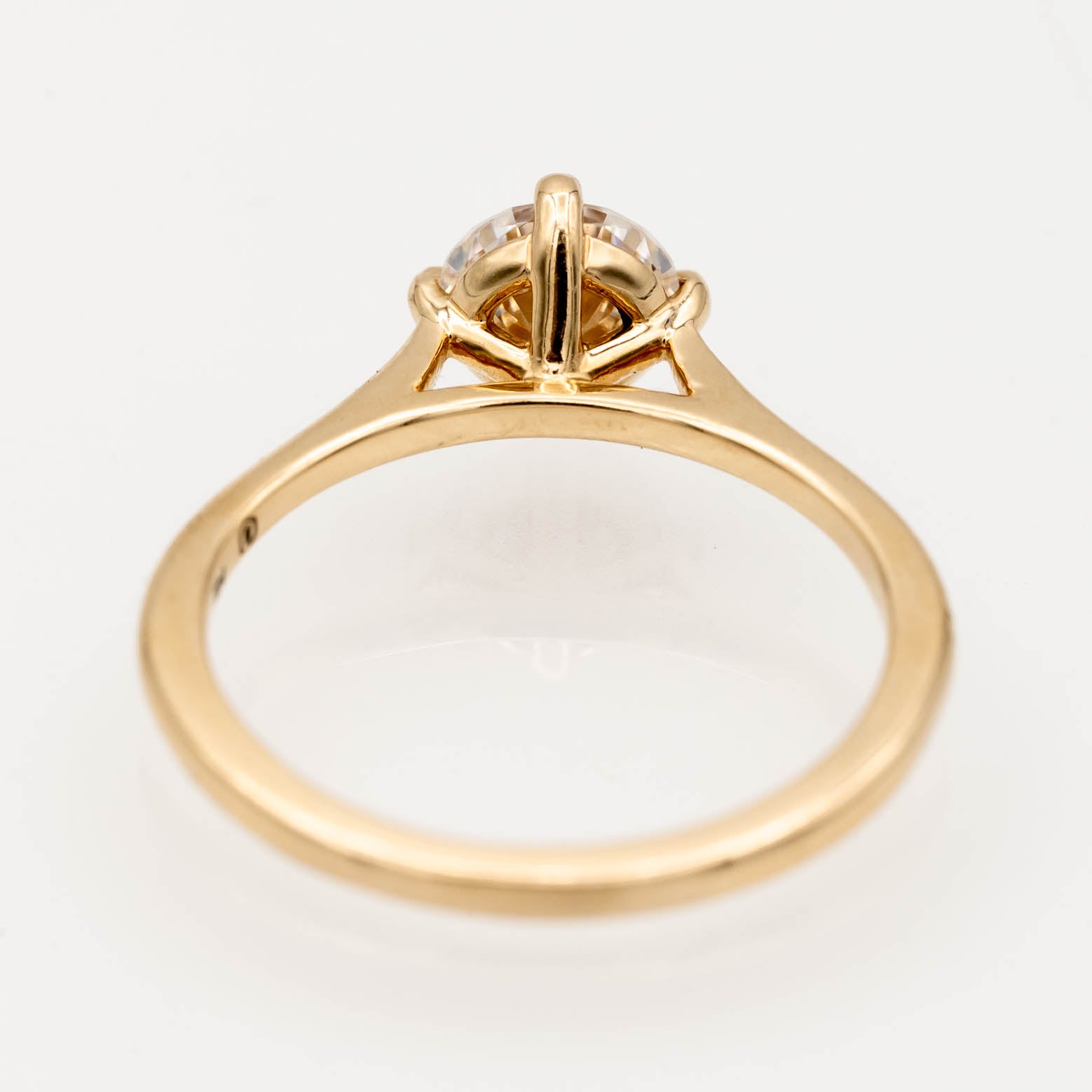 solitaire engagement ring, round-cut diamond ring, 14K yellow gold ring, classic diamond ring, minimalist engagement ring, prong setting ring, timeless jewelry, elegant proposal ring.