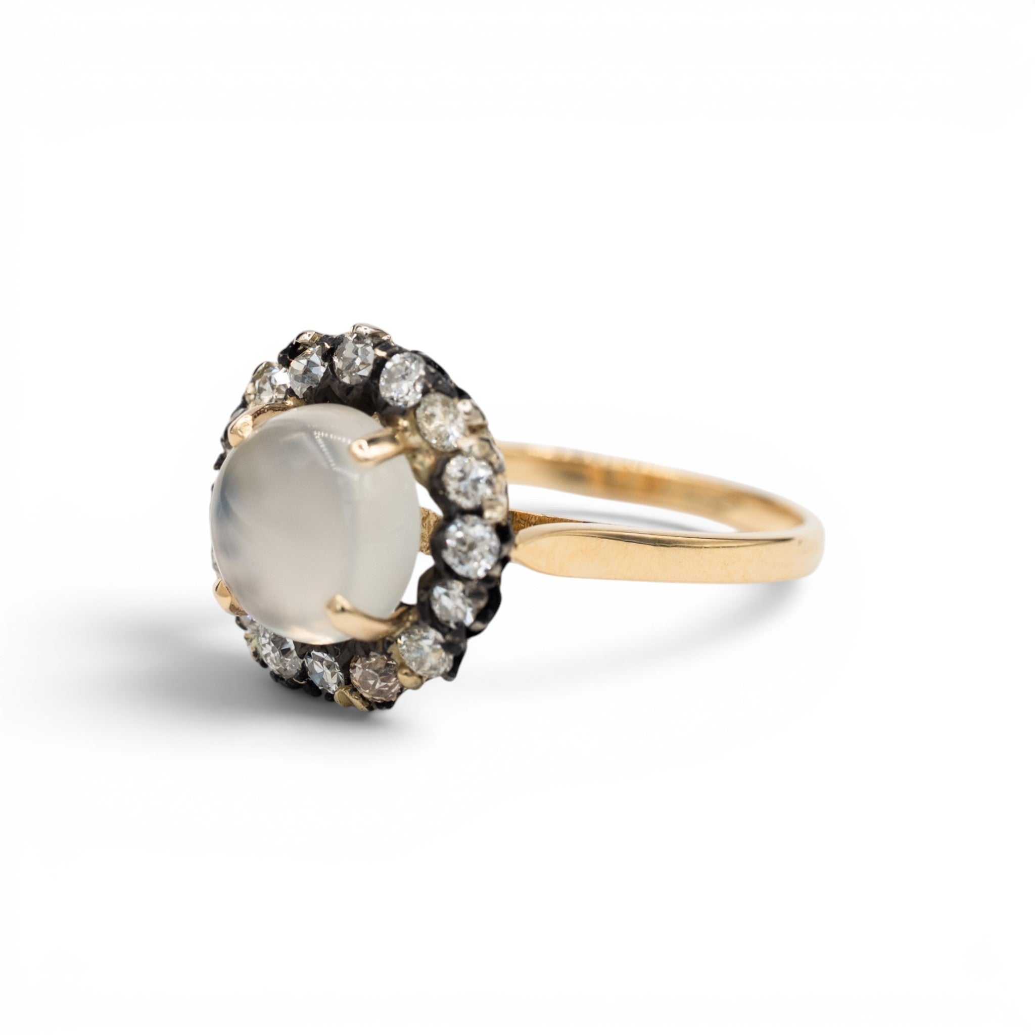 Stórica Studio moonstone and diamond halo ring in 14k yellow and white gold
