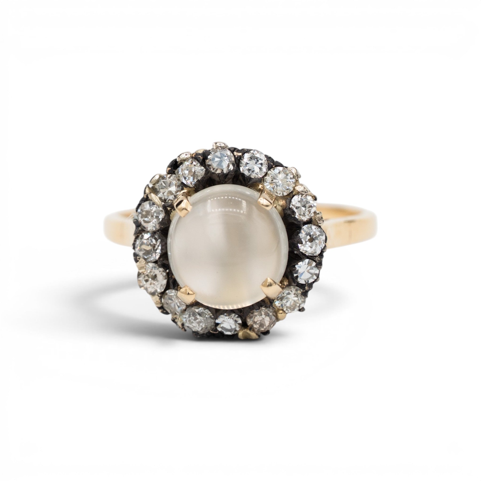 Stórica Studio moonstone ring with a diamond halo set in 14k yellow and white gold
