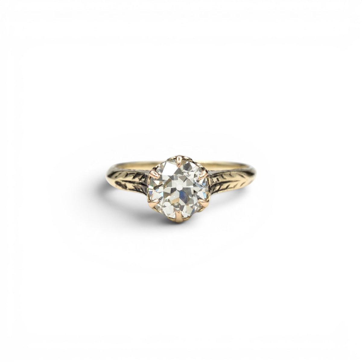 Stórica Studio Victorian 14k yellow gold solitaire ring featuring a 1.49ct Old European cut diamond with leaf detail.