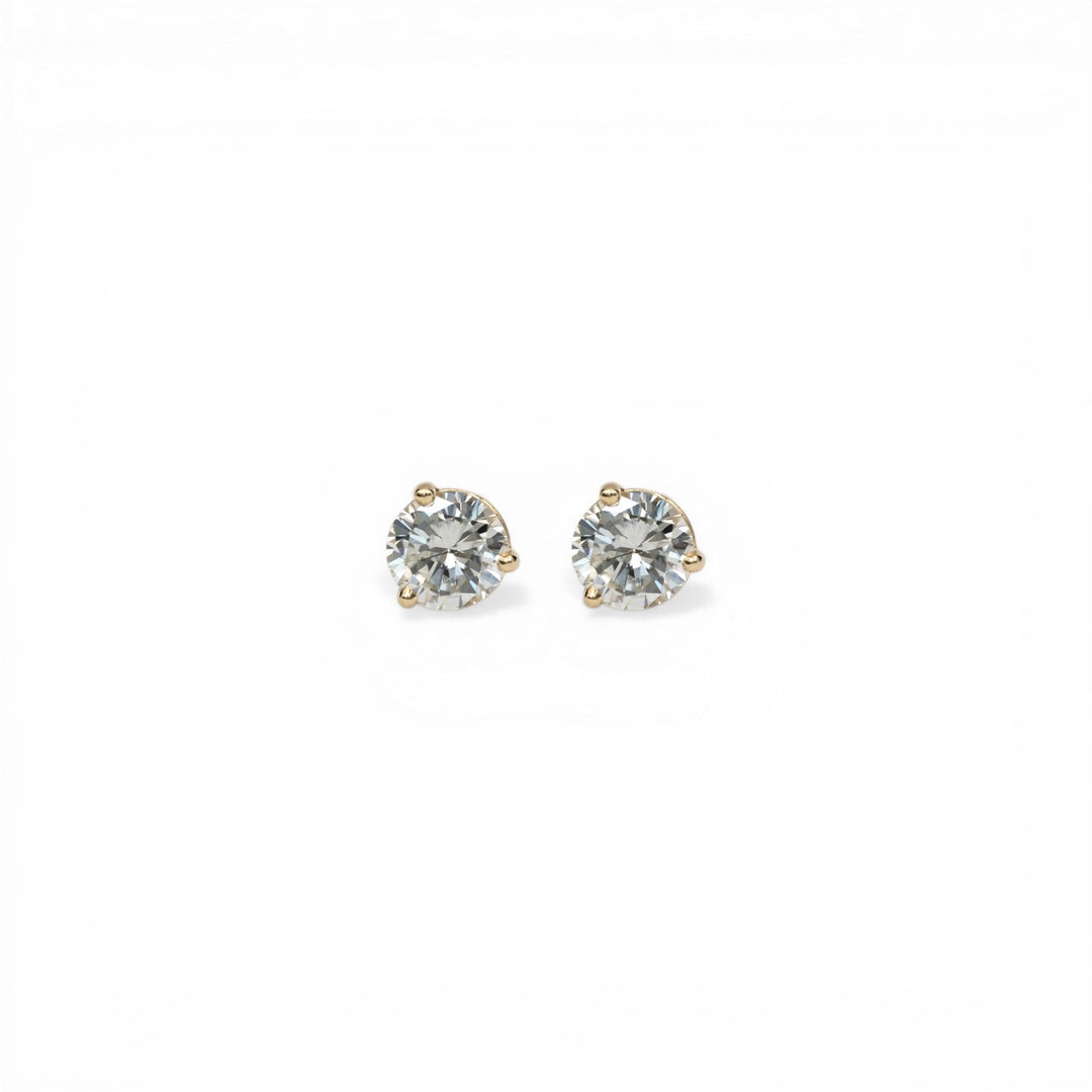 Stórica Studio 14k yellow gold stud earrings with 1ct bezel-set recycled diamonds in martini mounting.
