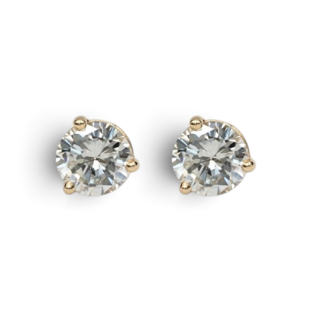 Stórica Studio 14k yellow gold stud earrings with 1ct bezel-set recycled diamonds in martini mounting.