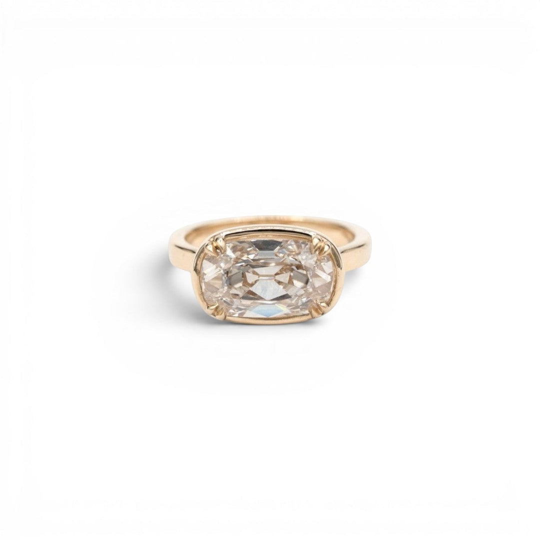 3.5ct lab-grown champagne antique-inspired cushion diamond in a double-prong faux bezel setting in 14k yellow gold, by Stórica Studio - custom engagement rings in Seattle.