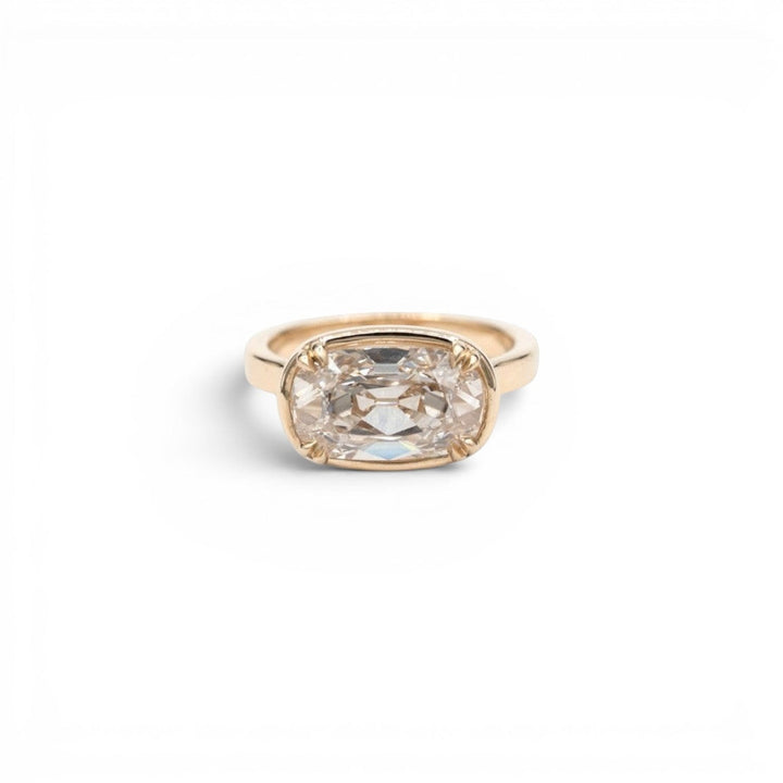 3.5ct lab-grown champagne antique-inspired cushion diamond in a double-prong faux bezel setting in 14k yellow gold, by Stórica Studio - custom engagement rings in Seattle.